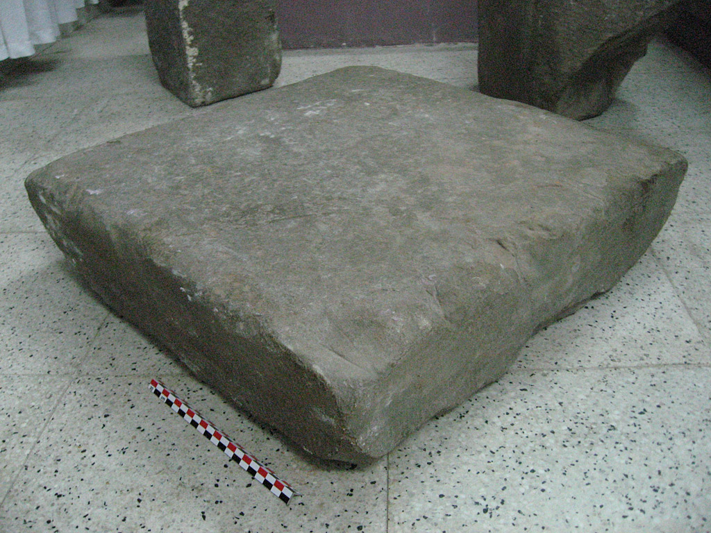 Photograph, with scale, showing the stone bearing inscription in three-quarter view. Taken in the Hanoi Museum by Arlo Griffiths on .