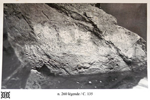 Photograph kept with EFEO estampage showing the rock wall bearing inscription , just above the water level.