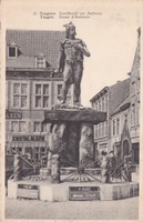 a photo of a statue of Celtic warrior standing on a dolmen