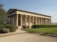 Photo of an ancient Greek temple in Athens with the city visible in the background