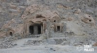 Photo of a temple carved into a mountain with the Sikait Project in the bottom right corner.