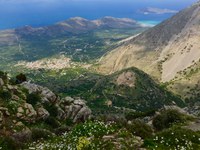 Photo looking down from mountain on Crete toward settlement site and coast line