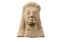 Fragmentary clay bust of a human figure with long hair (or perhaps a headdress?)
