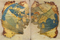 Photo of a fragmentary illustration of the world, showing various land masses and bodies of water.