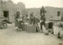 76. Excavation team packing pottery into boxes, Ur