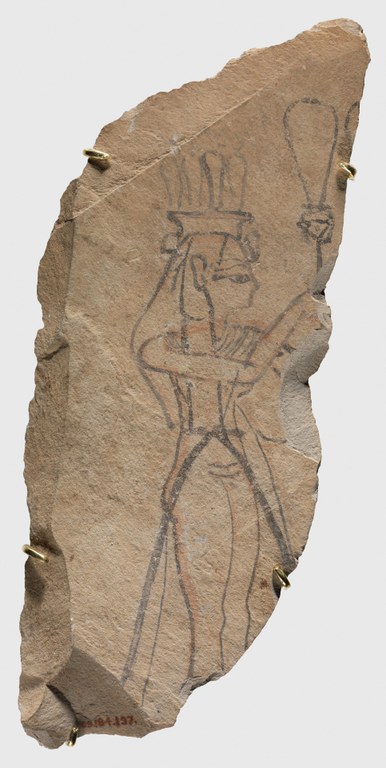 Drawing on stone of a woman, standing in profile, raising a rattle-like instrument, which consists of a handle and a large oblong loop above. The stone is broken at the woman's ankles, so she is shown without feet.