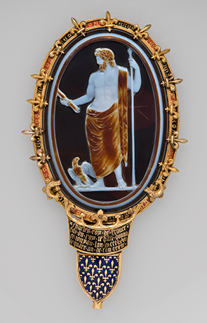 Oval-shaped sardonyx cameo of Jupiter with eagle, staff, and lightning bolt. Set in an elaborate gold and enamel mount.