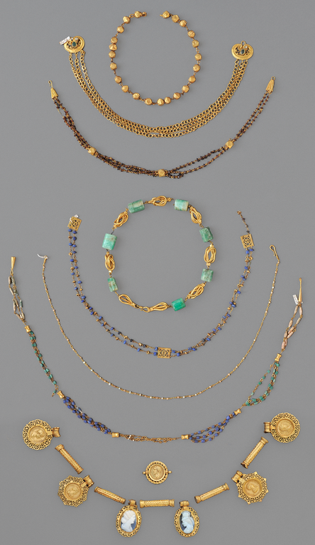 Photograph of eight necklaces.