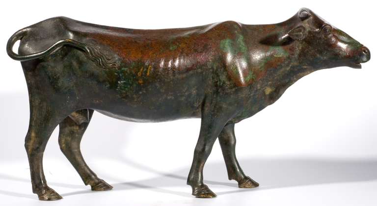 Photograph of a bronze statuette of a cow.