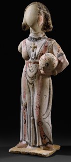  FEMALE FIGURE WEARING A DECORATED TUNIC