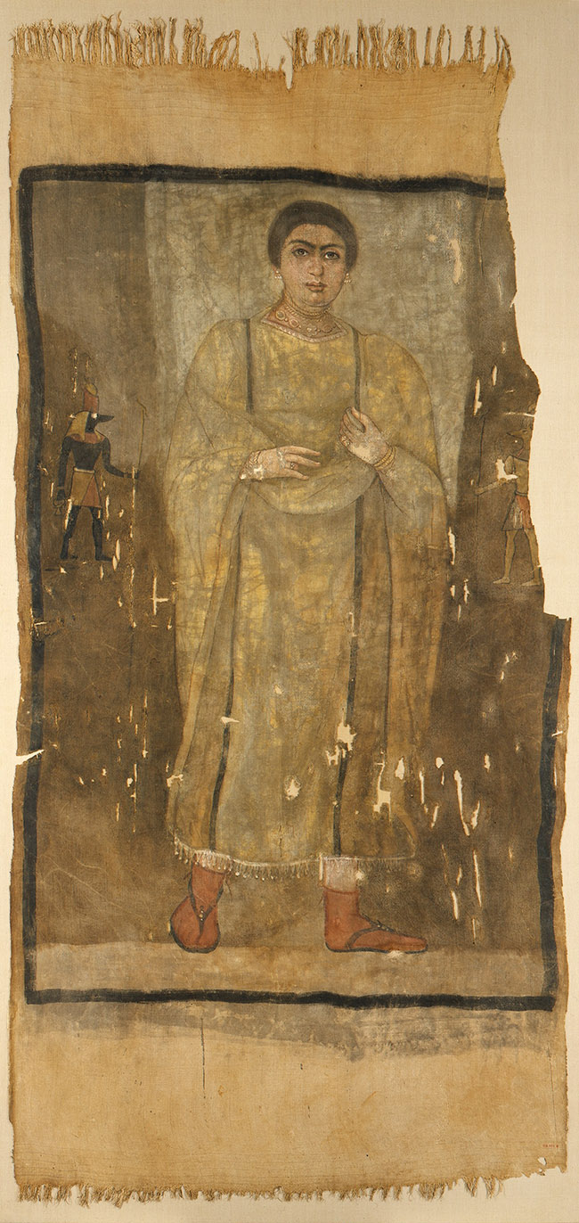 SHROUD OF A WOMAN WEARING A FRINGED TUNIC