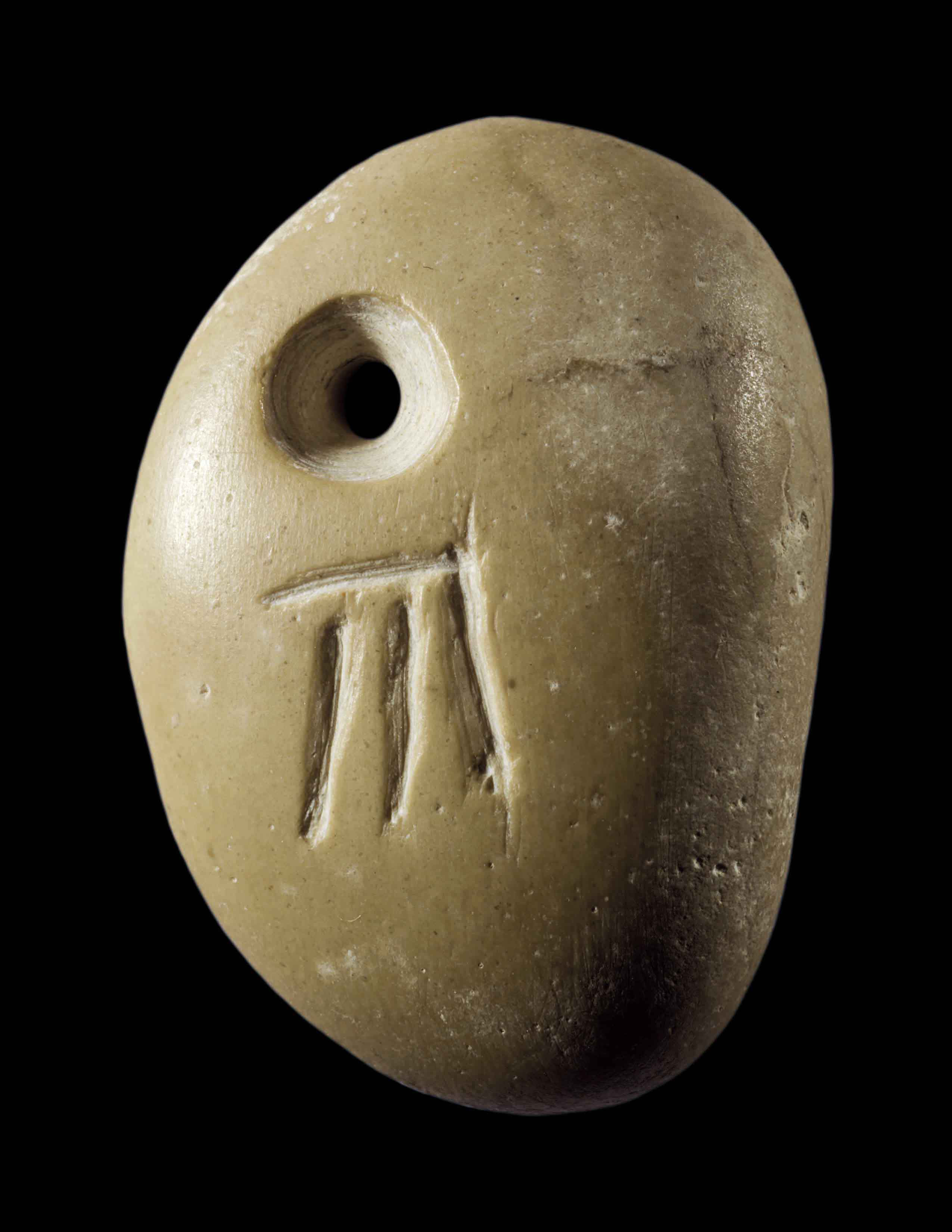 Pebble Amulet with Incised Symbol
