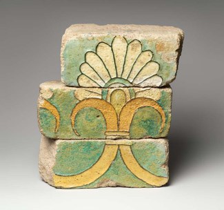 Three fragmentary bricks with palmette motif