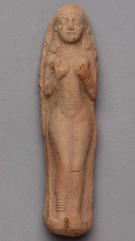 Molded clay cast of a female figurine. The cast is orange brown in color.