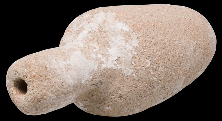 A jar or bottle-shaped mold made of clay with a long, narrow neck and a tiny hole running through it.