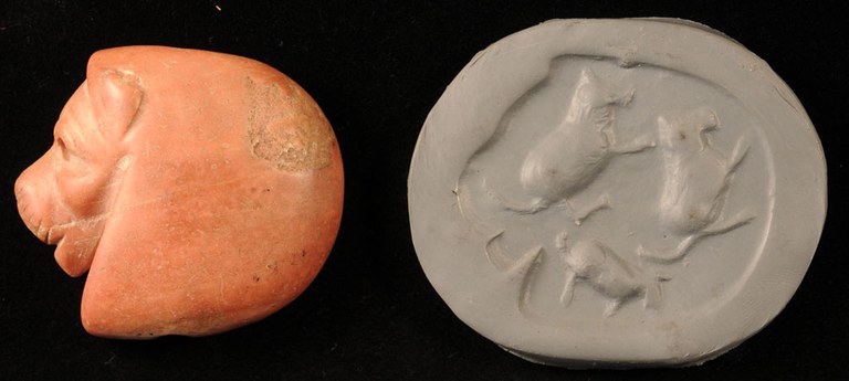 Photo on a black background showing an orangle marble stamp seal in the shape of a lion's head in profile (left) and a modern impression of the stamp seal (right) on which the outline of the lion's profile contains three other four-footed animal shapes.