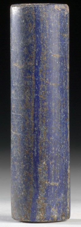 Blue cylinder with no carvings or markings.