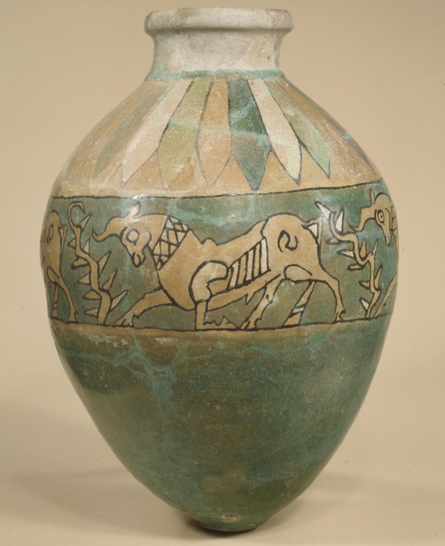 A vessel or a vase with stylized images of kneeling bulls in profile around the center. The vessel is made of glazed baked clay and is green, dull green, light brown, and off white hues. The bottom is light blue and has a slightly rounded bottom.