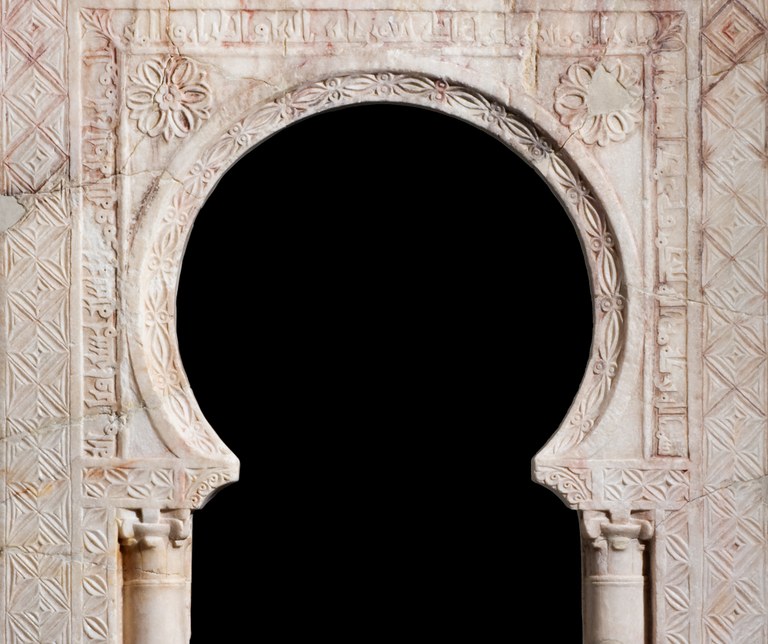 Arched niche with inscription