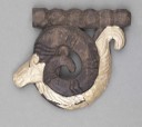 Sets of plaques were used to decorate ceremonial horse tack. The argali (mountain sheep) heads from this set are completed in an interesting way, with the animal’s beard extended back and under its neck to end in a curl that mimics the curve of the horn.