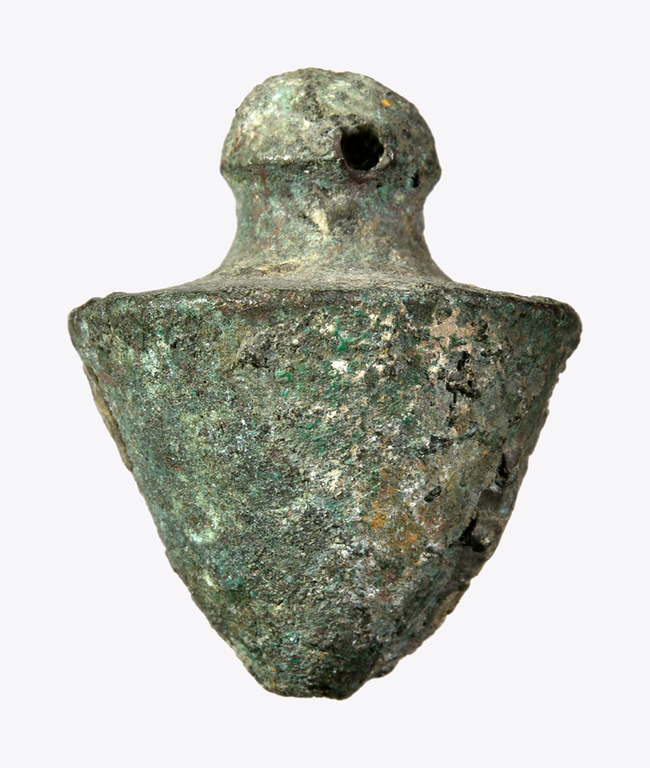A cone-shaped piece of bronze nob at the apex.