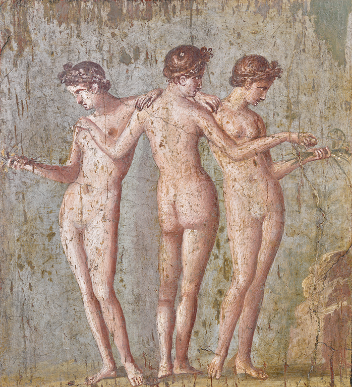 Two nude women are shown frontally on either side of a third nude woman seen from the back at center. The hair of each is wreathed in braids. The women stand on a nearly flat, barren plane, with a small rocky outcropping at the lower right. The figures posed frontally hold sheaves of grass in one hand, while the central figure extends her arms across the other two, as if to embrace the one at left and to hand a small spherical object to the one at right.