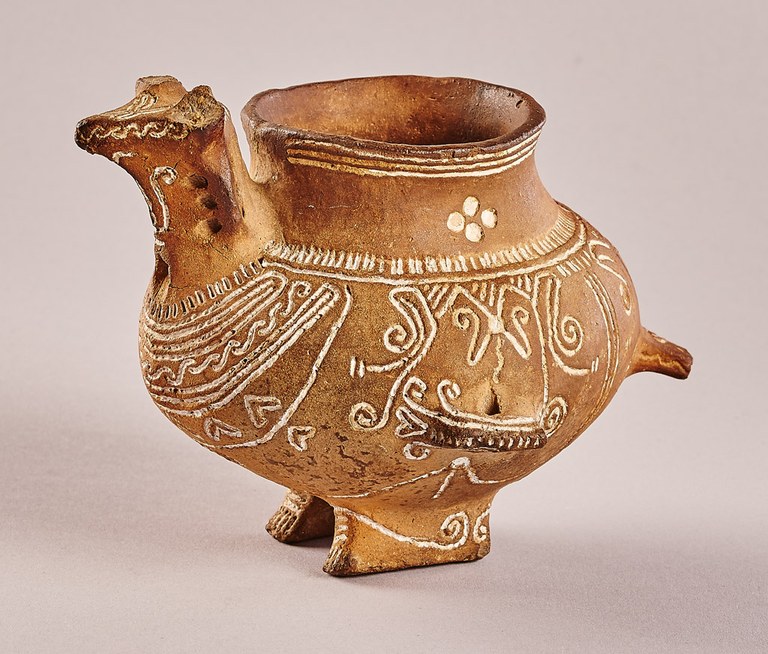 A vessel combining the body of a bird with the head of a horned animal and human feet. The vessel is decorated with incised designs.