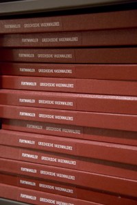 Stack of books with red binding