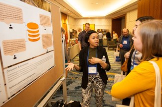 Jasmine Smith presenting a poster on her thesis research at the 2019 American Research Center in Egypt Meeting