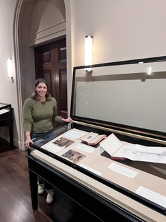 Museum Studies intern Mina Turunc helps finish up installation of vitrines on the second floor of ISAW that explore the reception of Islamic Spain.