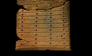 Colophon of a tablet from the Library of Ashurbanipal, showing several lines of cuneiform text consisting of "colophon c."