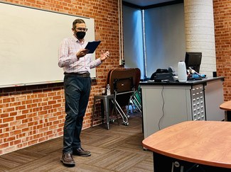 Patrick J. Burns delivering a paper at Trinity University