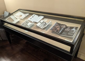 Display case showing open books with images of neolithic and Bronze Age objects from the Balkan Peninsula and the Carpathian Basin.