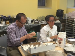 Junli Diao helping to make Puabi cylinder seal deserts for Michael Rakowitz's Enemy Kitchen, May 2015.