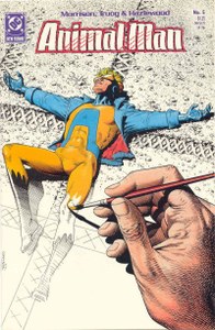 The cover of Animal Man #5, showing an oversized hand painting a superhero in a cruciform pose.