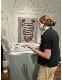 Priya Barchi explaining objects in the "Ritual and Memory: The Ancient Balkans and Beyond" exhibition at ISAW