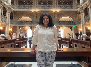 PhD student Safa Abdulaziz in a library