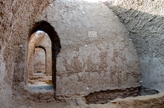 View through two doorways in crypts of an ancient mudbrick church