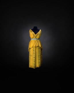 A yellow silk dress costume with painted black leaf motifs