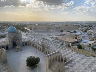 Panoramic view over Bukhara's 16th century congregational mosque (Masjid-i Kalon) towards the citadel (Ark) with excavation area visible in between.