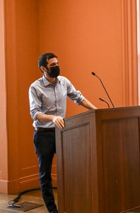 Lorenzo Castellano speaking at the lectern in ISAW lecture hall