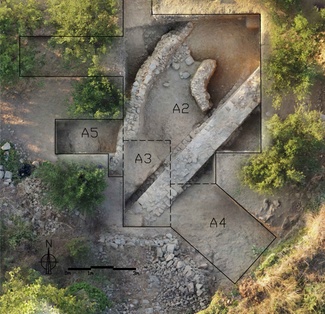 Aerial image of an excavated area containing curved and straight stone walls as well as other stone features in the middle of partially treed area. Labeled polygons overlie the image with labels like "A2", "A3", "A4", and "A5".