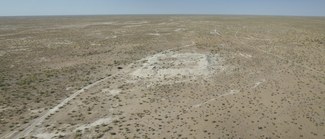 aerial view of Kyzyl-kum Desert-Steppe, Site Ak-Rabat-1, where remains of caravanserai are visible