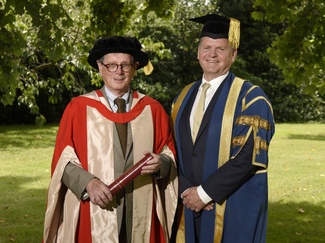 an image of Robert (left) shown with Robert Van de Noort (right), Vice-Chancellor of the University of Reading both in academic regalia..