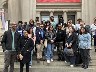 photo of group of students and ISAW staff standing of the Met