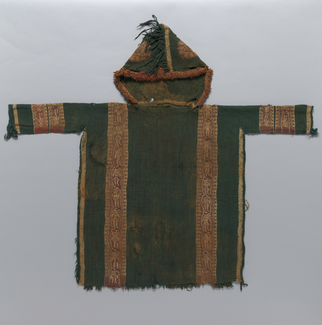 A green hooded tunic with golden edging, two vertical bands in red and gold, red and gold bands circling both sleeves, and patterns in red and gold on the hood is photographed lying flat.