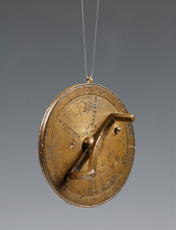 Image of a portable universal bronze circular sundial with roman numerals on it. The circular sundial resembles a pocket watch