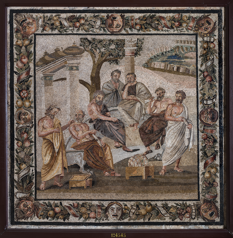 An intricate mosaic depicting severazl men in robes sitting and standing under a tree with a landscape in the background. See text of article for further description.