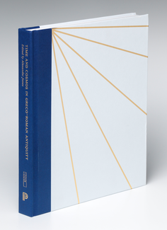 A hard-bound book stands on its edge. The front cover is white with a series of radiating cold lines. The spine is blue, and on it appears indistinct text written in gold type.