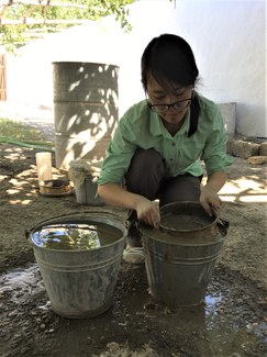 Photo of Shujing Wang in the field.